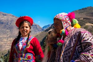 Native Peruvian group with their Llama in Sacred Valley, Cusco, Peru